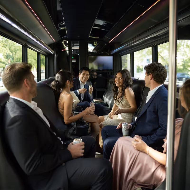 Wedding guests seated inside a St. Louis party bus