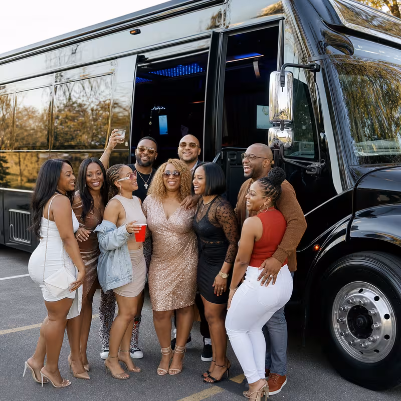 Group boarding a white charter bus for Birthday Transportation transportation in St. Louis