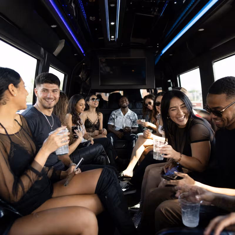 Passengers loading luggage while boarding an St. Louis group shuttle