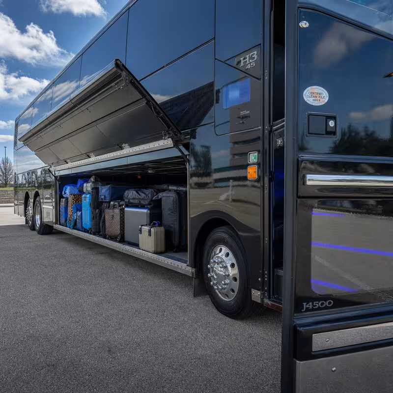 Party bus interior with wraparound leather seating and LED lighting in St. Louis