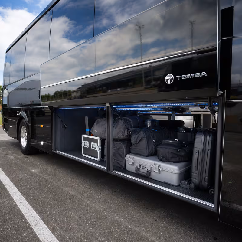 Party bus interior with wraparound leather seating and LED lighting in St. Louis