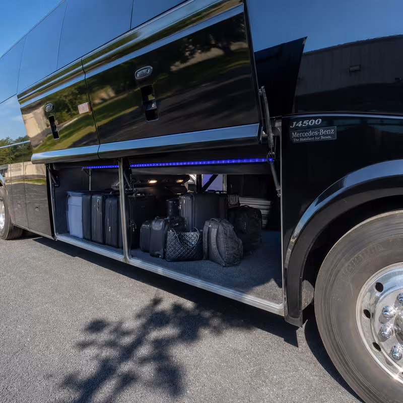 Party bus interior with wraparound leather seating and LED lighting in St. Louis
