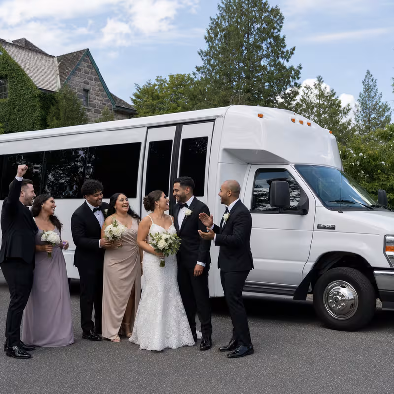 Passengers loading luggage while boarding an St. Louis group shuttle